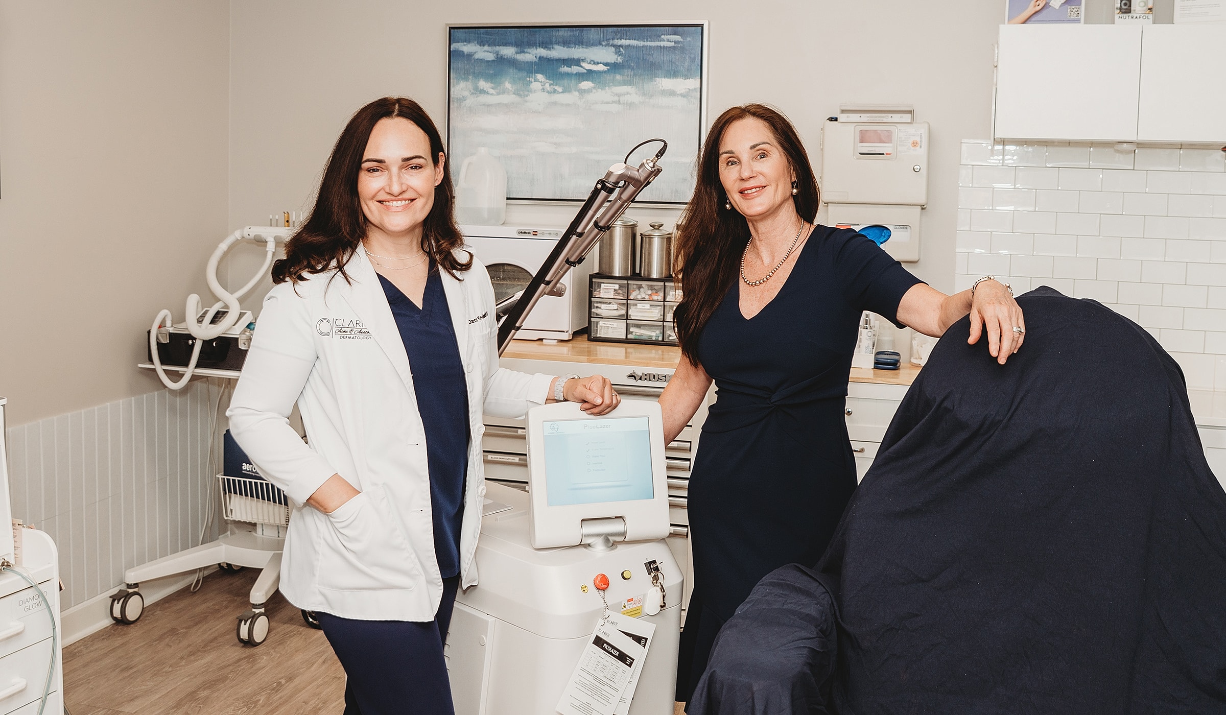 Medical professionals in a treatment room setting.