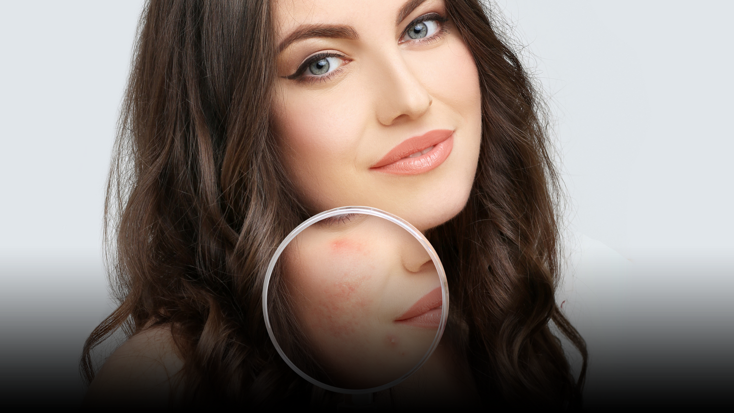 Woman with makeup and skin blemishes under magnification.