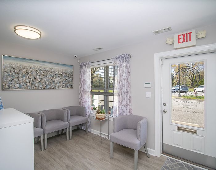 Welcoming reception area with seating and artwork.